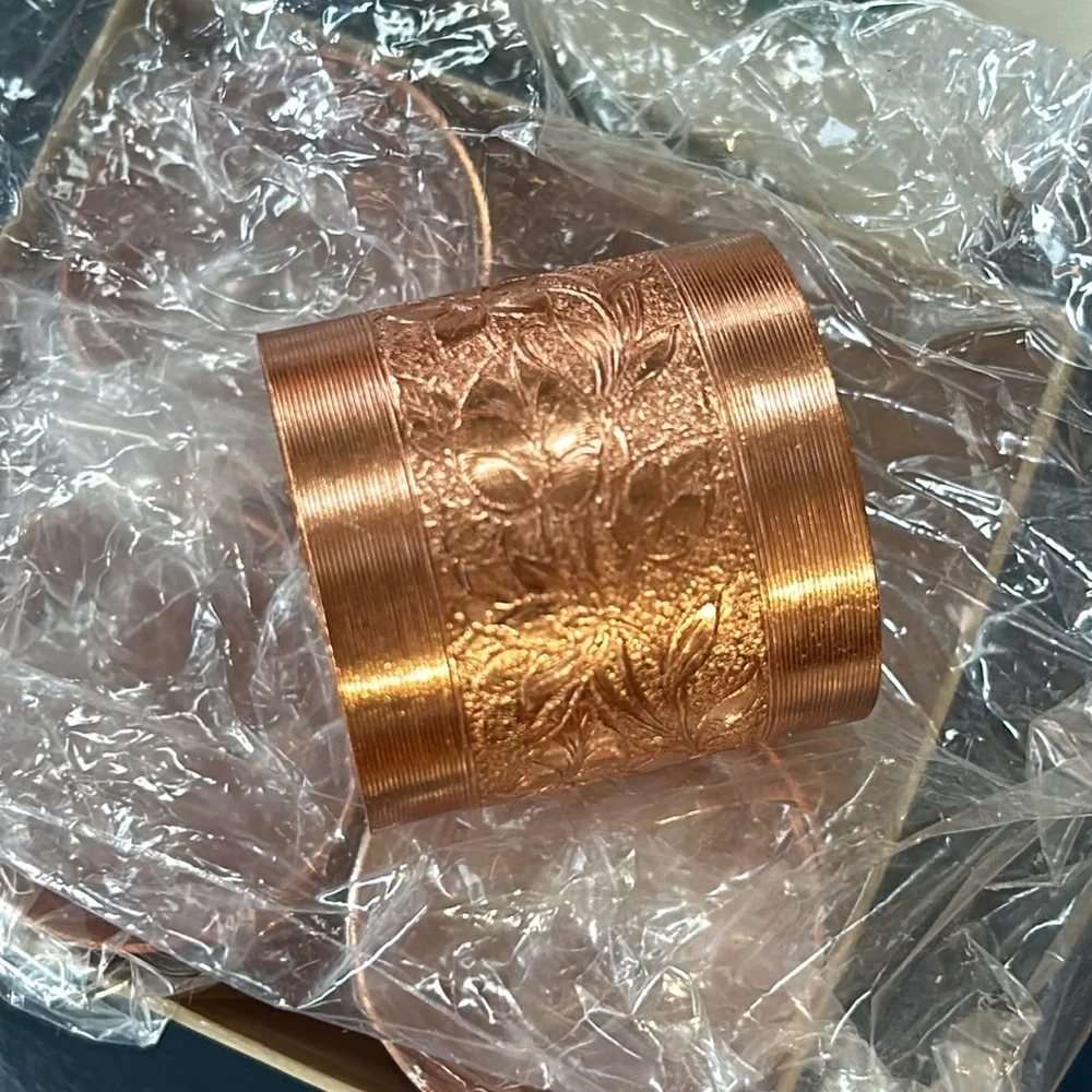 Vintage Coppercraft set of 4 copper napkin rings in box.
